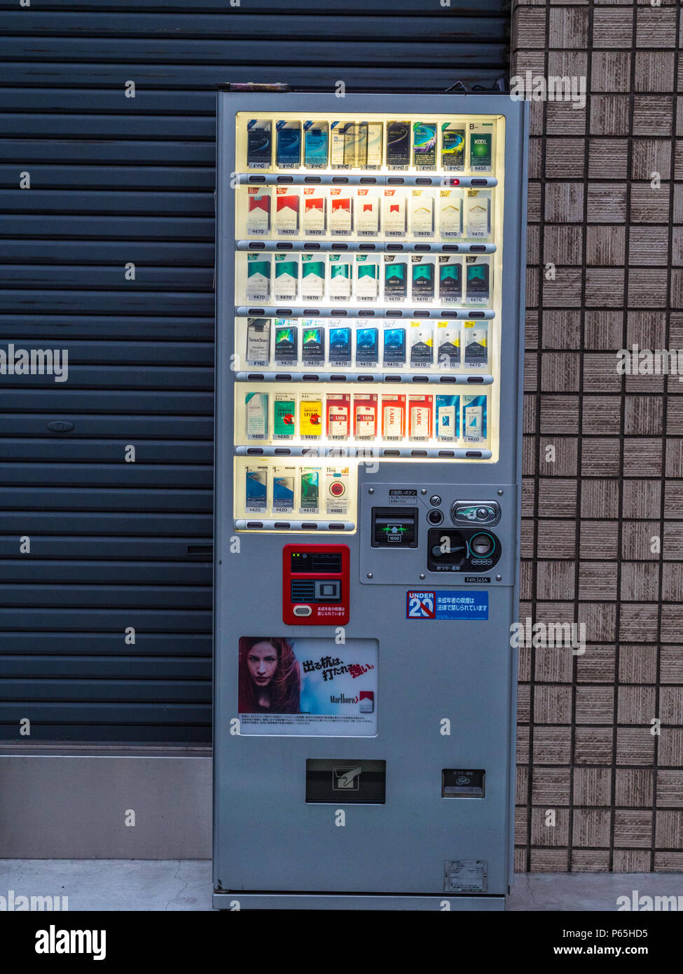 Vendor machine for cigarettes in the streets of Tokyo - TOKYO / JAPAN - JUNE 17, 2018 Stock Photo