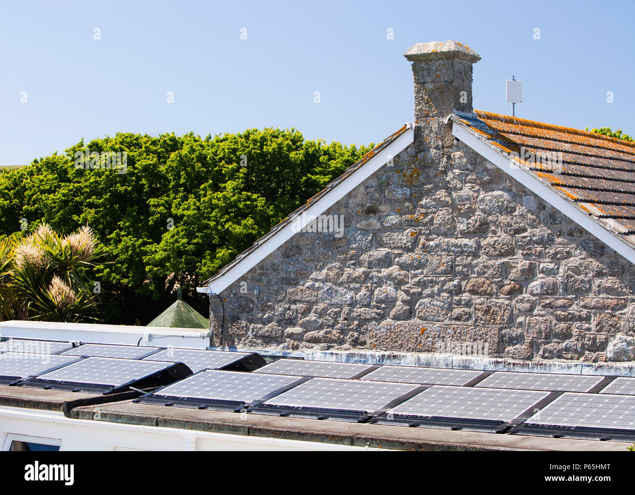 Solar electric panels on the roof of the Tresco and Bryher primary school, Isles of Scilly, UK. Stock Photo