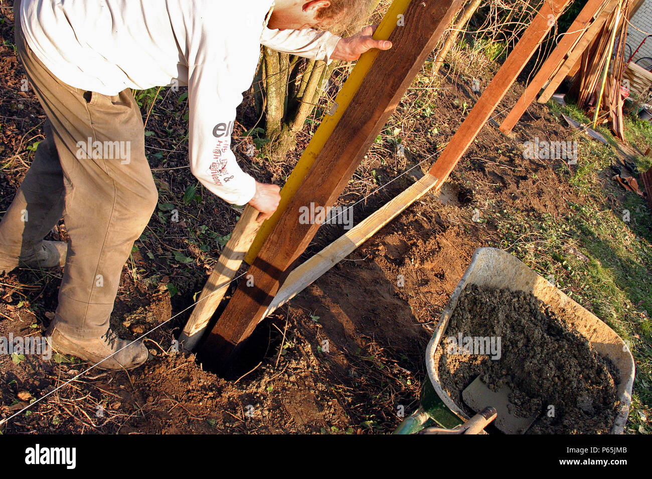 Man Building Fence Stock Photo Alamy