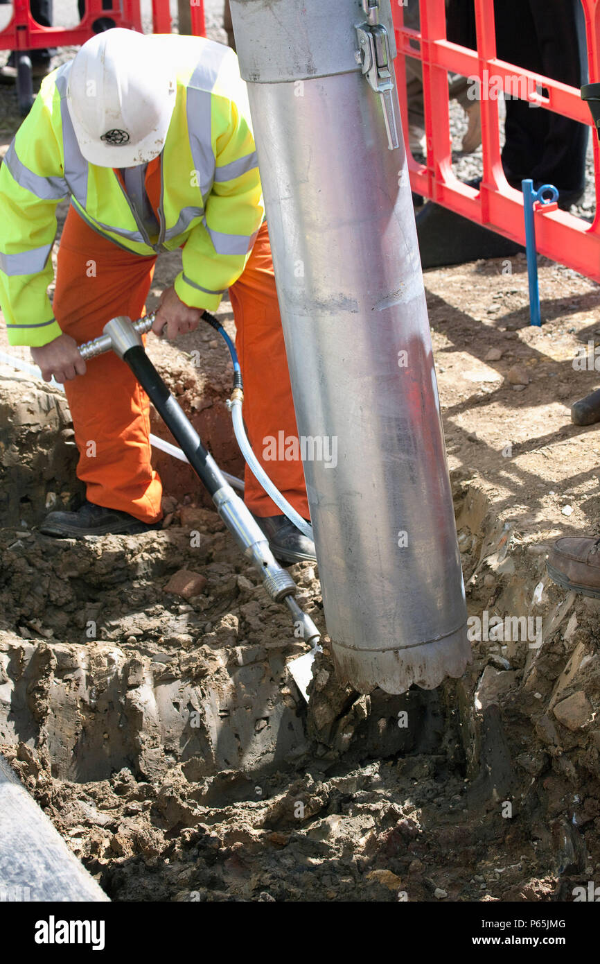 Machine for sucking up debris on construction site. Stock Photo