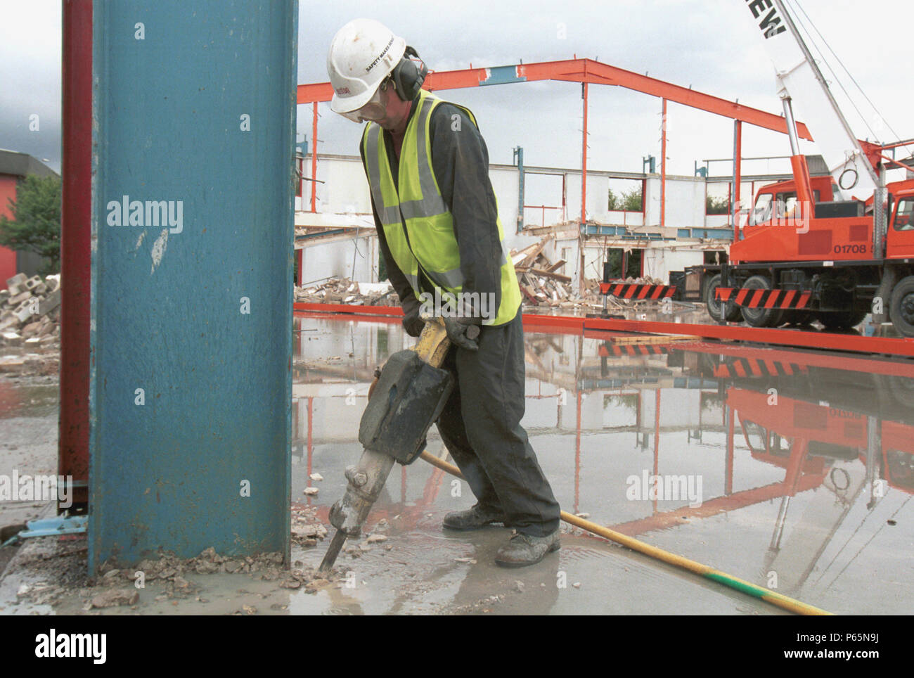 Demolition. Breaking concrete with Pneumatic Drill Stock Photo Alamy