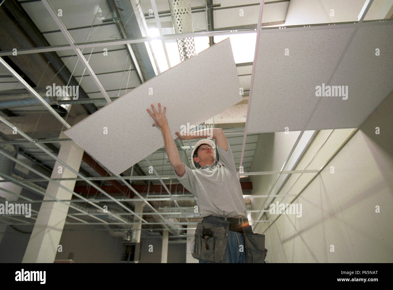 Fitting Tiles Into Suspended Ceiling Grid Stock Photo Alamy