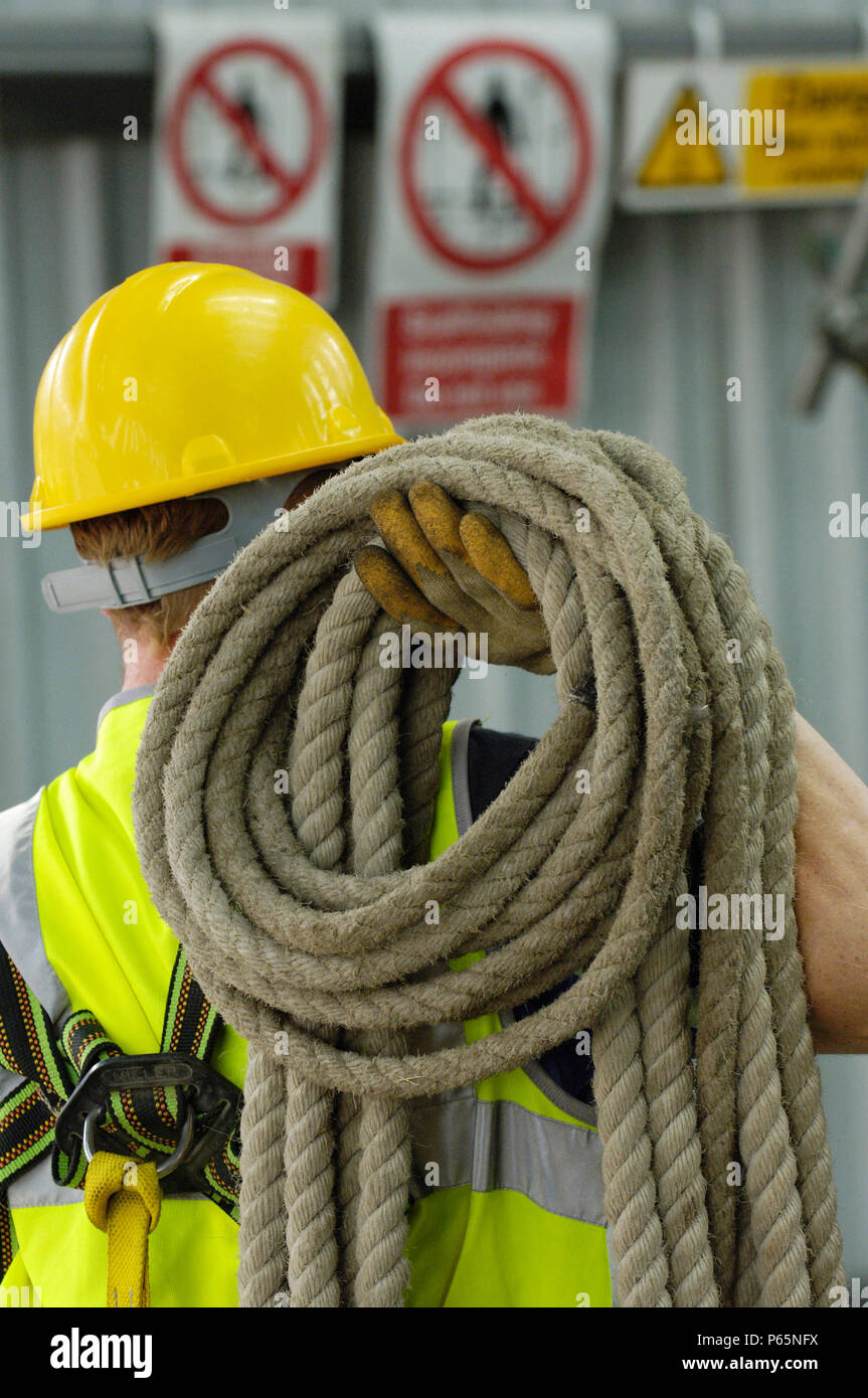 Workers With Ropes Construction worker with safety belt and rope on his shoulders Stock ...