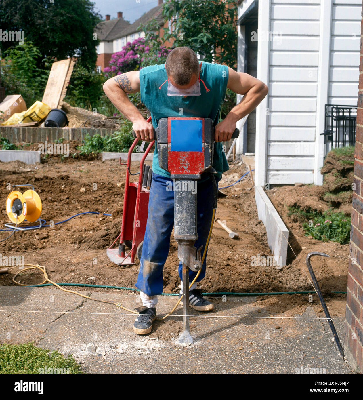 Breaking out reinforced concrete using pneumatic drills Stock Photo Alamy