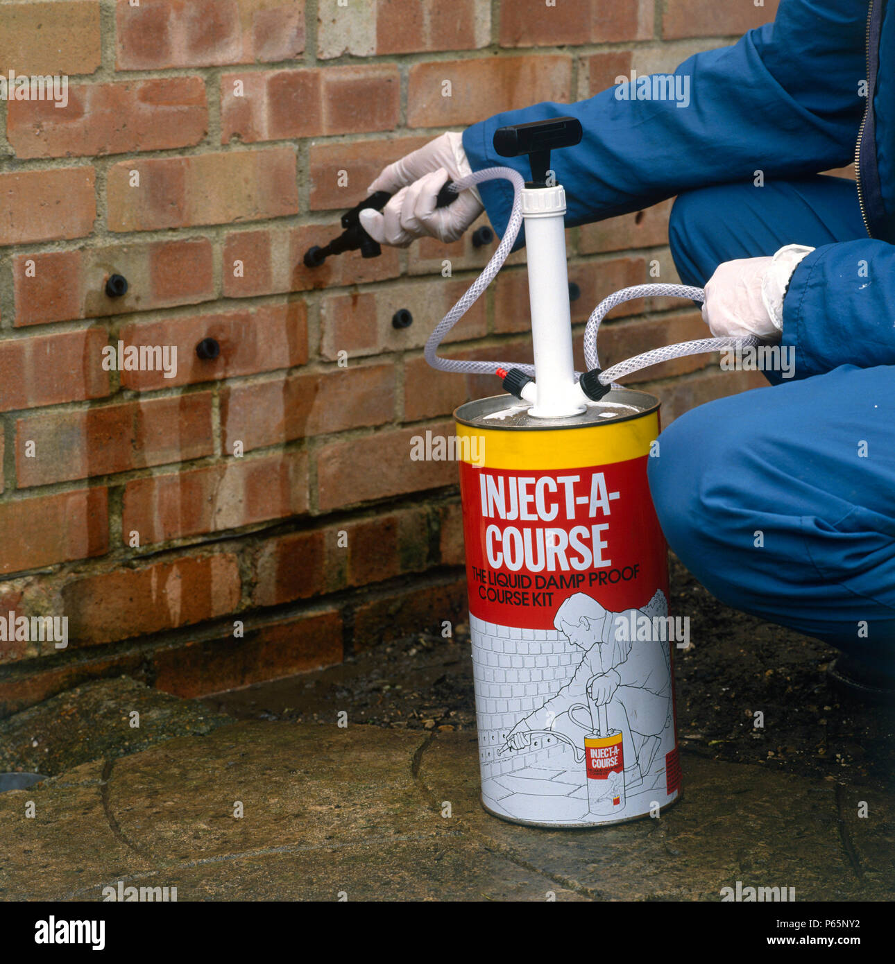 Penetrating damp course applied to an external wall Stock Photo