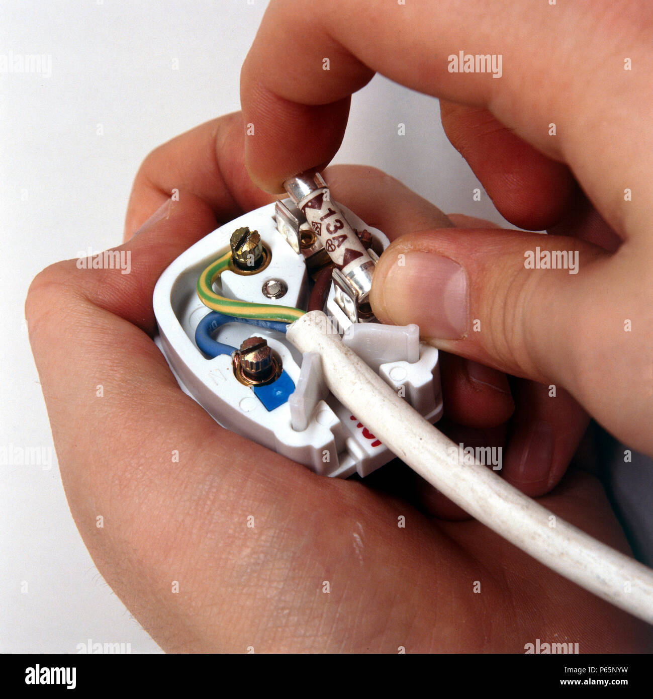 Replacing a fuse in a three pin plug Stock Photo Alamy