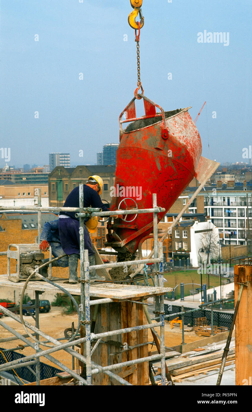 Formworking. Pouring concrete into a formwork column Stock Photo