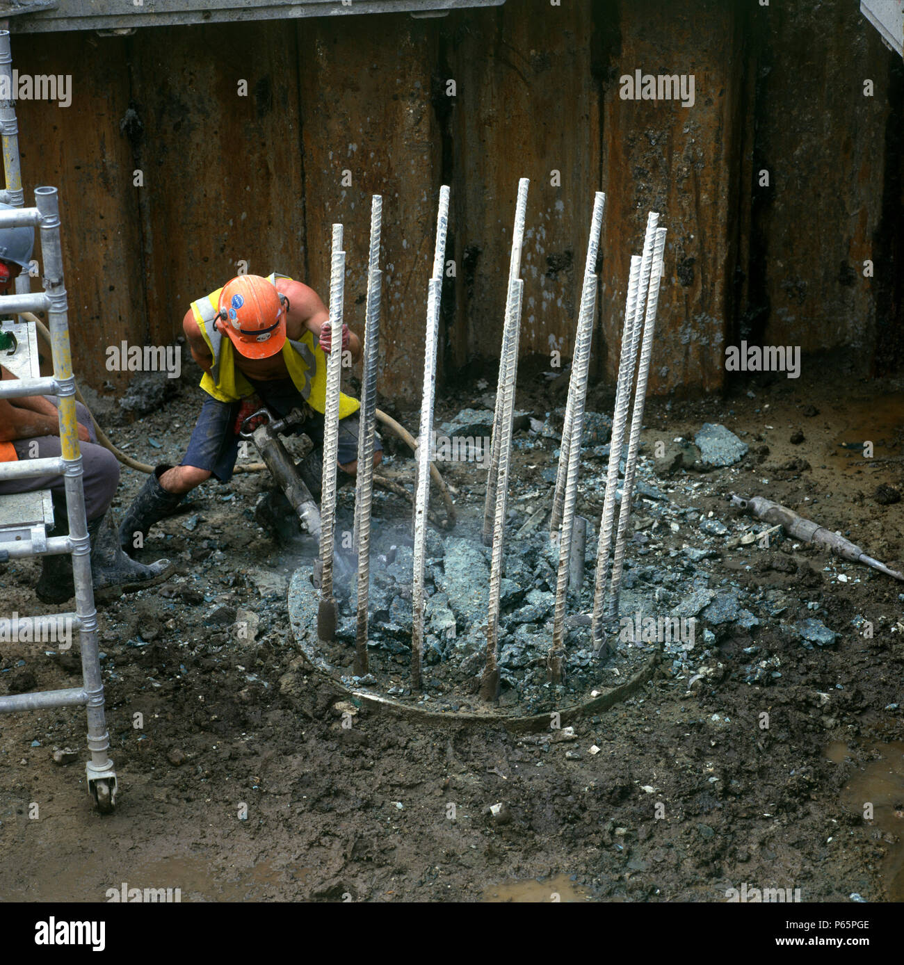Breaking out reinforced concrete using pneumatic drills Stock Photo Alamy