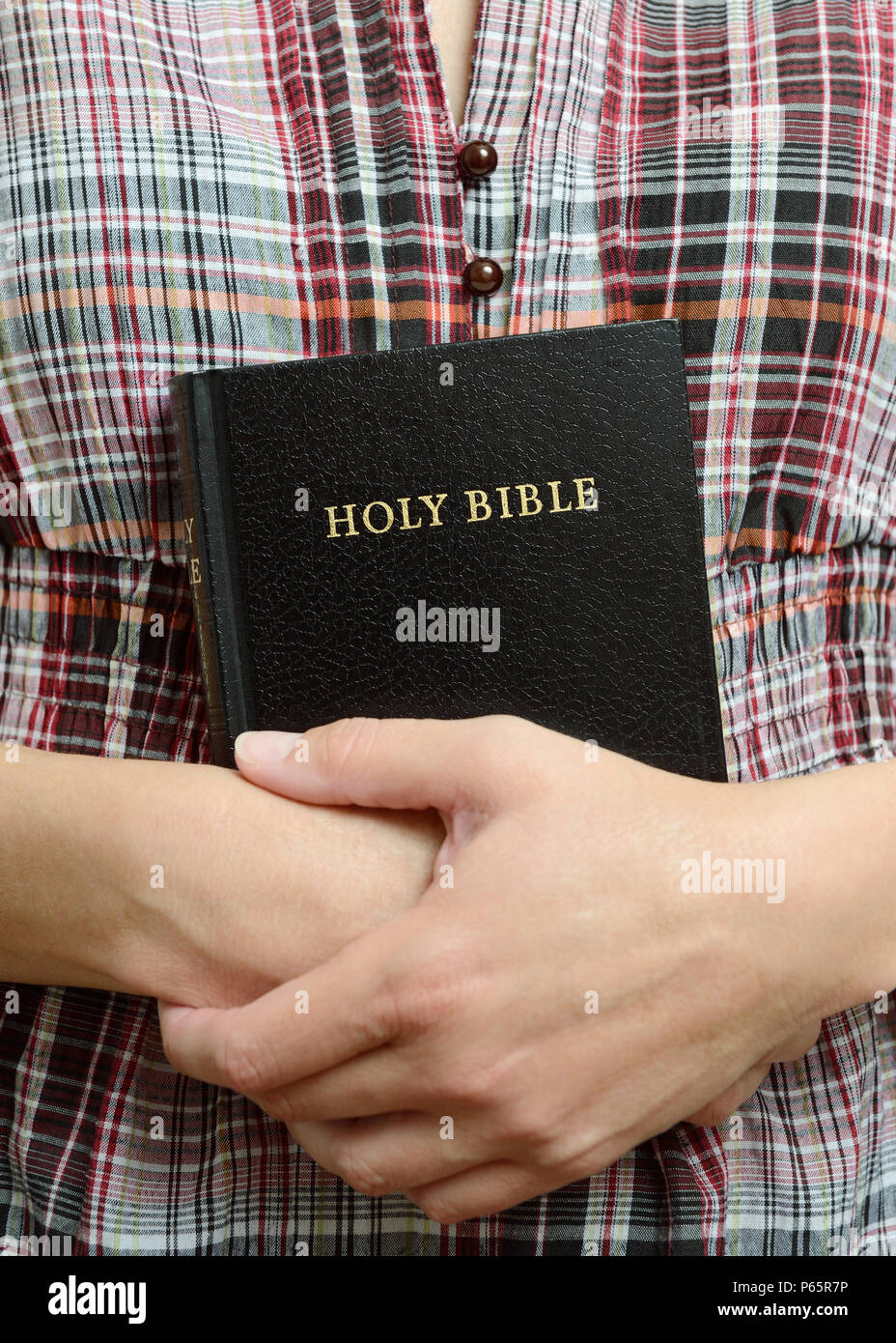 Young Woman Holding a Bible Stock Photo - Alamy