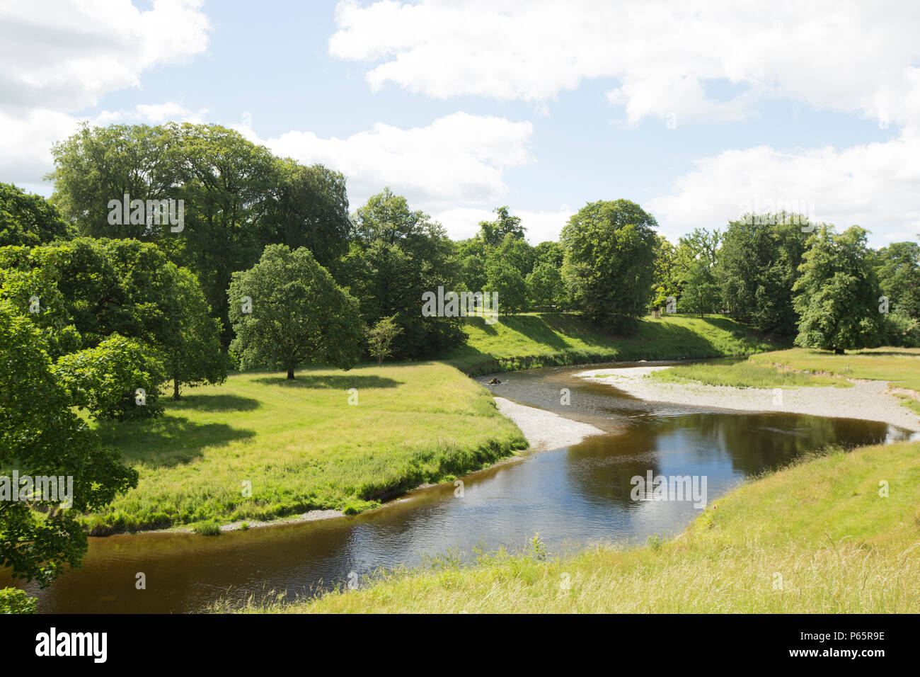The River Kent flowing through Levens Hall Park in Cumbria England UK