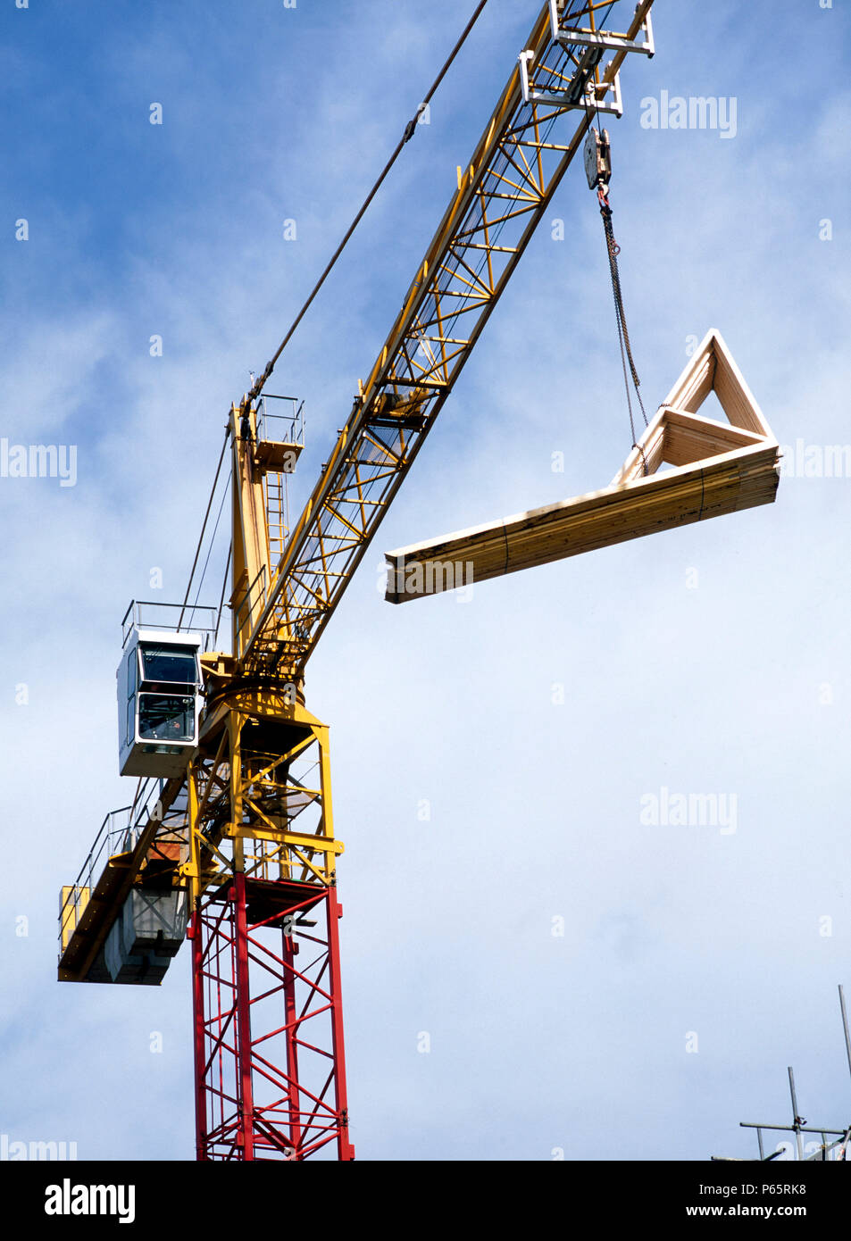 Building material delivered by a crane lift Stock Photo - Alamy