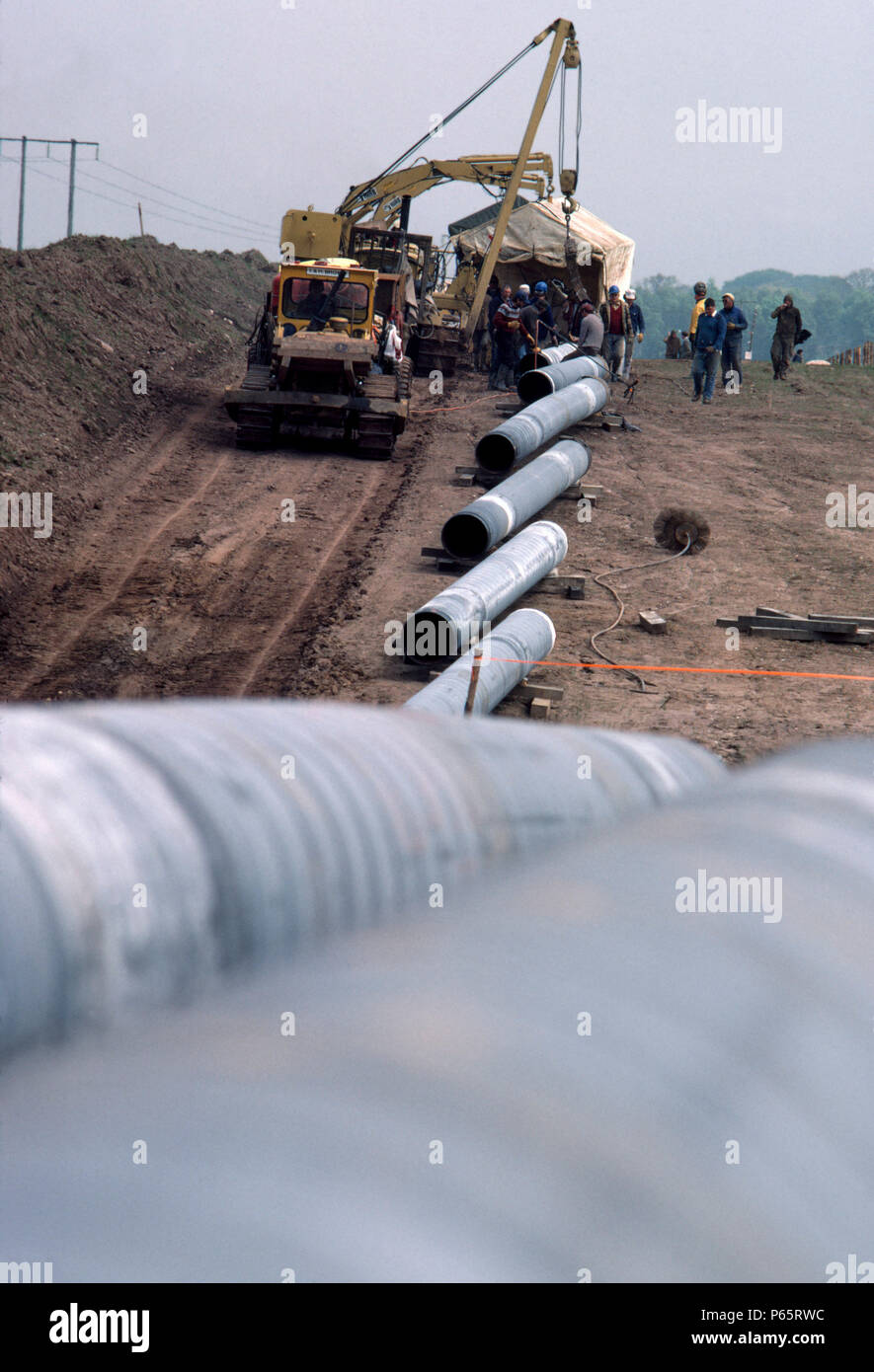 Positioning pipe sections during pipeline construction Stock Photo - Alamy