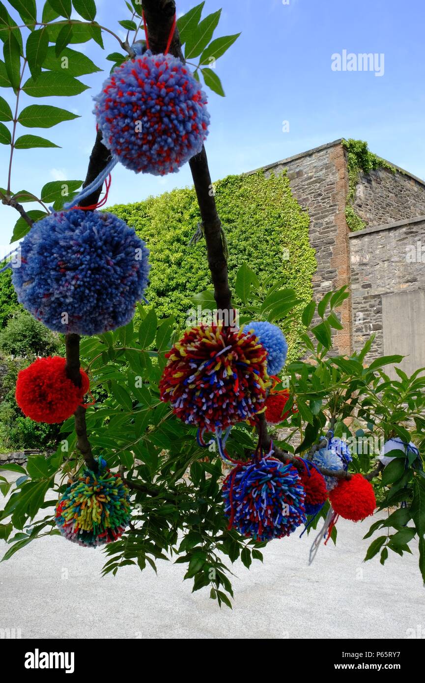 Baubles Made With Wool Pom-Poms on the tree Stock Photo