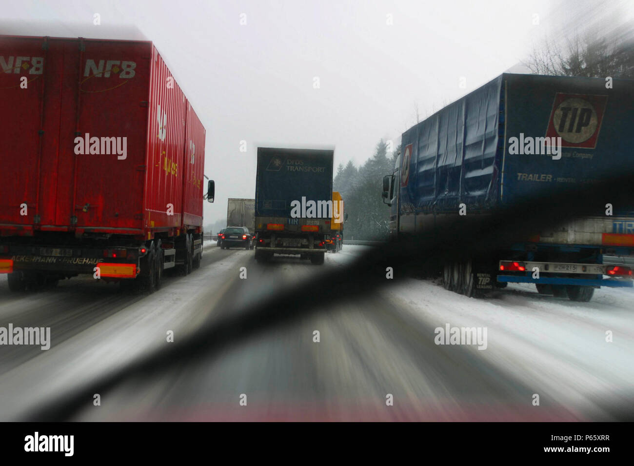 Driving in the snow with motorway congestion Stock Photo