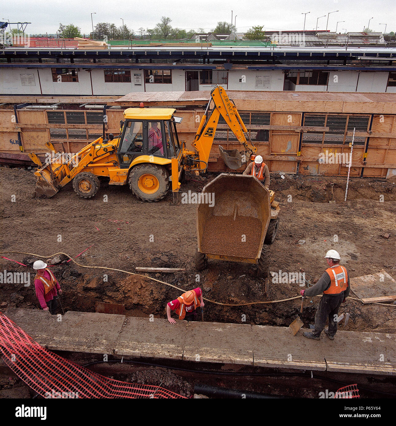 Tipper filling trench Stock Photo Alamy