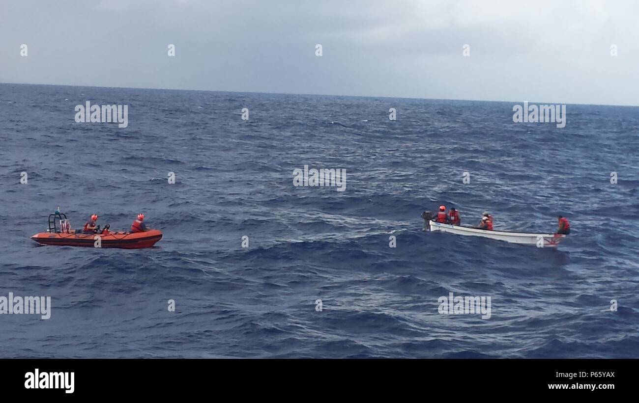 The USCGC Assateague (WPB 1136), homeported in Santa Rita, Guam, rescued four fishermen from an 18-foot skiff 61 miles west southwest of Fais Island, in the Federated States of Micronesia, May 9, 2016.  The crew of the Assateague located the skiff, brought the fishermen aboard and brought them to Falalep Island with the skiff in tow. (U.S. Coast Guard photo/Released) Stock Photo