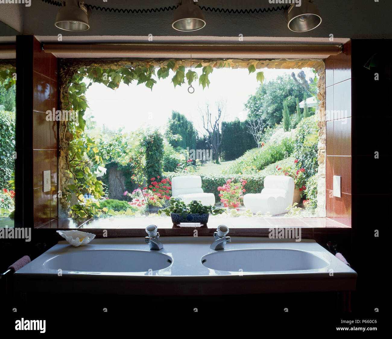 View of two sinks against a window Stock Photo