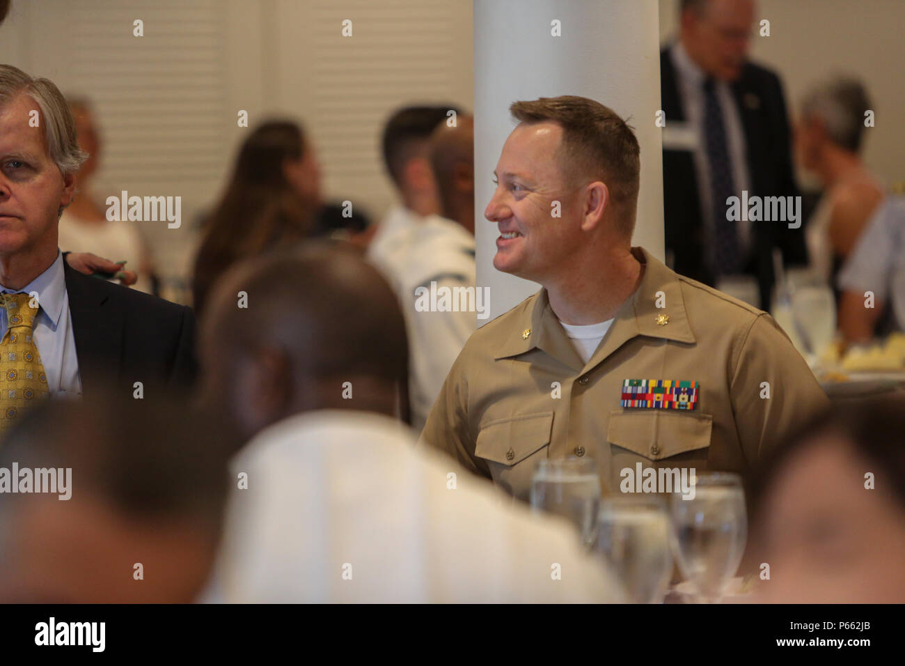 Maj. Andre LaTaste, the Marine Forces Command programing officer, speaks to the Port Everglades Association during a Fleet Week luncheon, May 6, 2016. Fleet Week, which takes place in Fort Lauderdale, Fla., from May 2-8, will give the community of South Florida the opportunity to interact with the Marines and Sailors of the ship as well as see up-close and personal some of the capabilities and equipment the Marine Corps employs. (U.S. Marine Corps photo by Cpl. Michelle Reif/Released.) Stock Photo