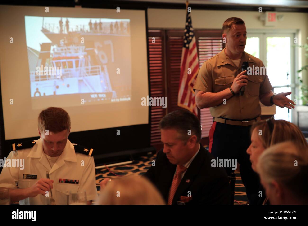 Maj. Andre LaTaste, the Marine Forces Command programming officer, speaks during the Port Everglades Association Luncheon as part of Fleet Week Port Everglades, Fort Lauderdale, Fla., May 6, 2016. Fleet Week will give the community of South Florida the opportunity to interact with the Marines and Sailors of the ship as well as see up-close and personal some of the capabilities and equipment the Marine Corps employs. (U.S. Marine Corps photo by Lance Cpl. Brianna Gaudi/Released.) Stock Photo