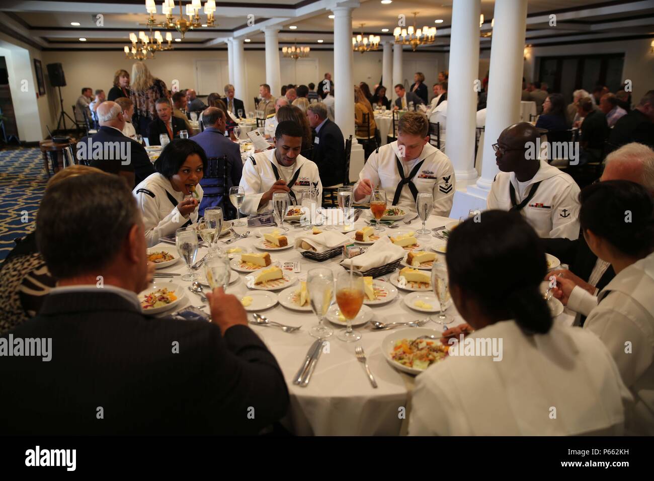 Marines and Sailors attend the Port Everglades Association Luncheon as part of Fleet Week Port Everglades, Fort Lauderdale, Fla., May 6, 2016. Fleet Week will give the community of South Florida the opportunity to interact with the Marines and Sailors of the ship as well as see up-close and personal some of the capabilities and equipment the Marine Corps employs. (U.S. Marine Corps photo by Lance Cpl. Brianna Gaudi/Released.) Stock Photo