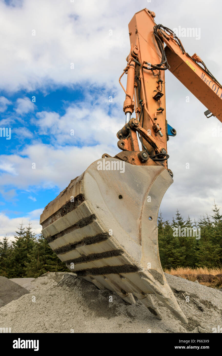 Digger bucket with hydraulic arm Stock Photo