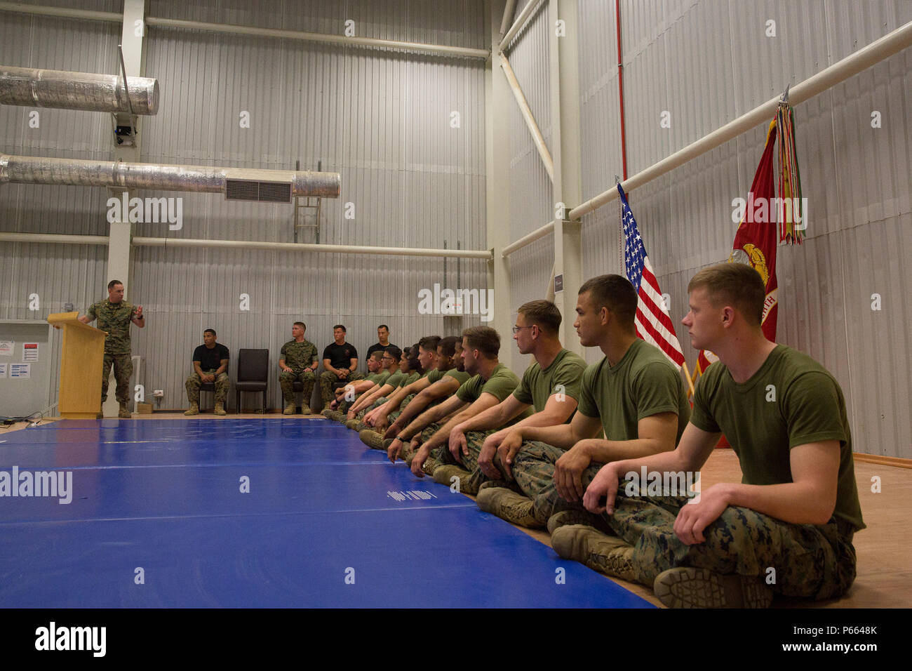 U.S. Marine Corps Maj. Christopher M. Reynolds, the executive officer of Black Sea Rotational Force, addresses the soon to be Marine Corps Martial Arts Instructors during their graduation ceremony aboard Mihail Kognalniceanu Air Base, Romania, April 22, 2016. These graduates spent three weeks enduring physical training sessions, learning how to correctly give hip-pocket classes, and how to properly teach techniques of all belt levels of the Marine Corps Martial-Arts Program. (U.S. Marine Corps photo by Cpl. Kelly L. Street, 2D MARDIV COMCAM/Released) Stock Photo