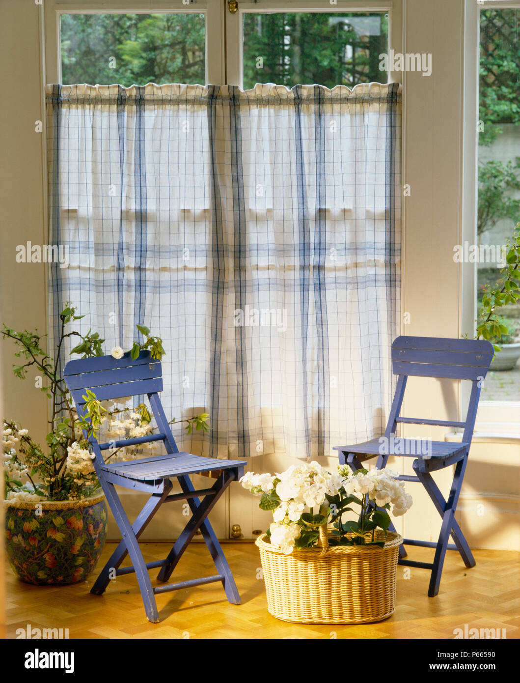 Blue Painted Wooden Chairs In Front Of Windows With Blue Checked
