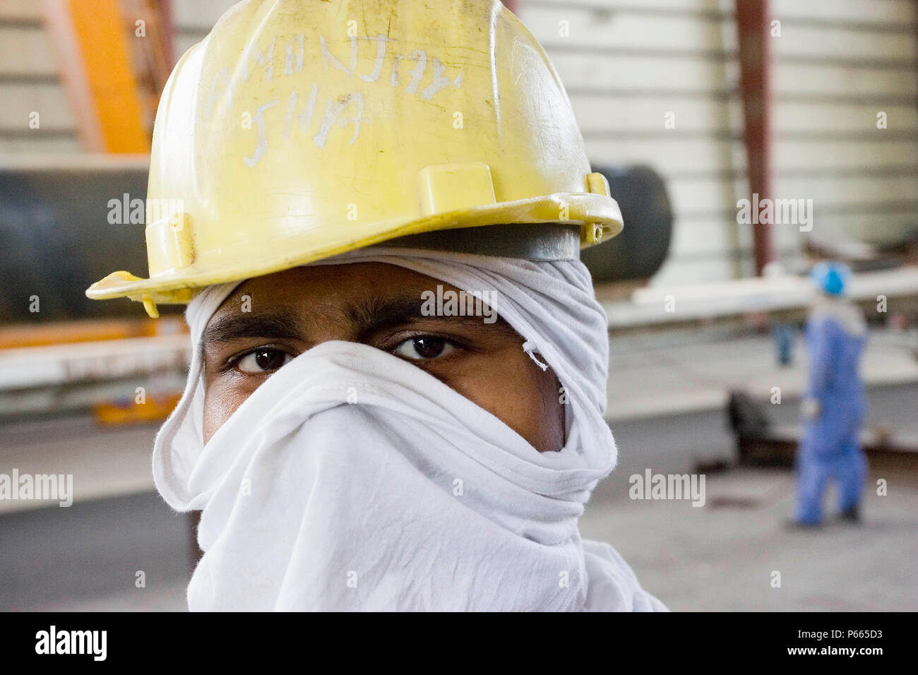 Workers at Hyojong Pipe factory, Doha. Stock Photo