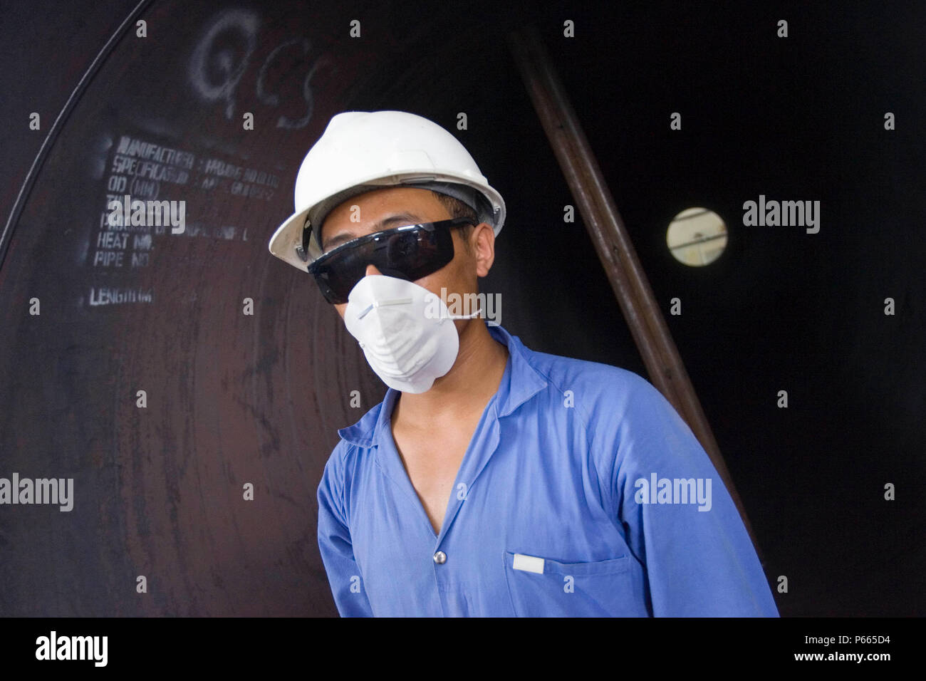 Workers at Hyojong Pipe factory, Doha. Stock Photo