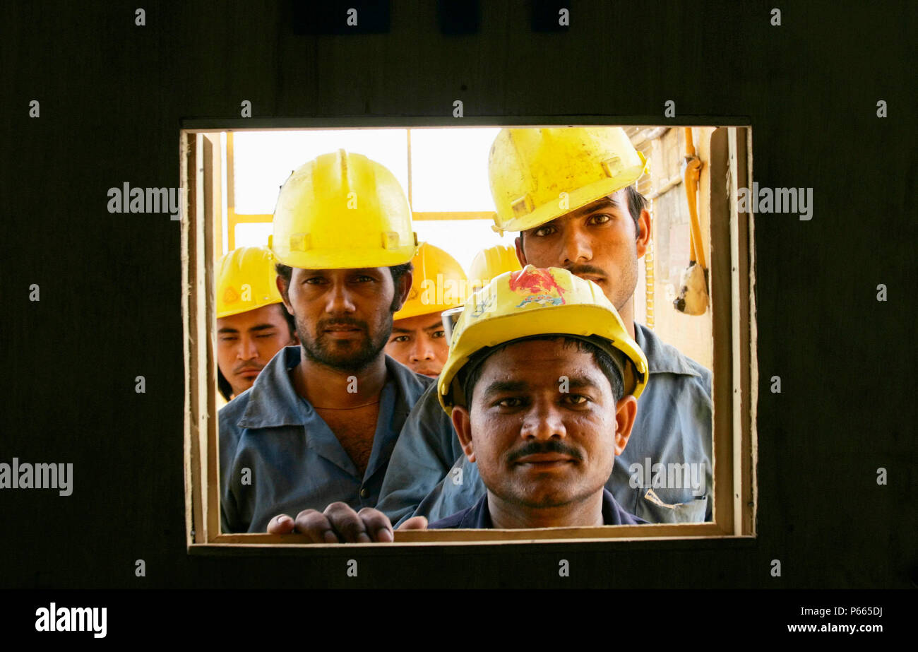 Construction workers on a new sky scrapper Stock Photo