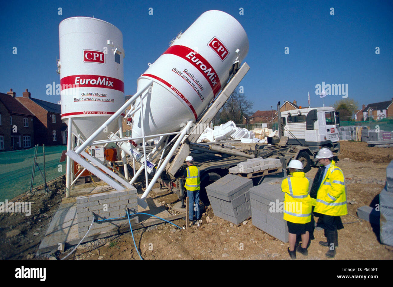Concrete batching. Cement Silo being delivered on a property