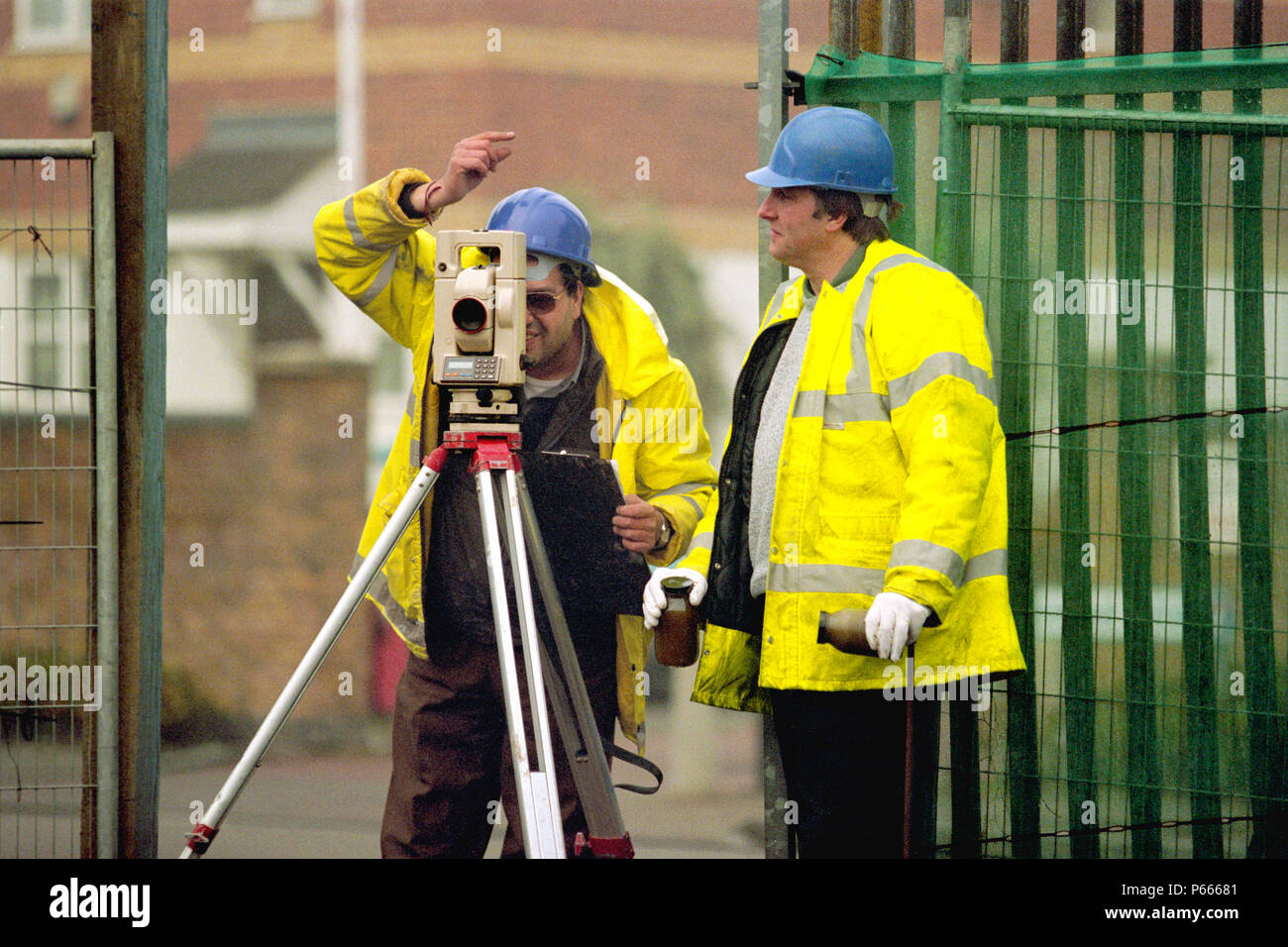 Surveyor using total station on site. Stock Photo