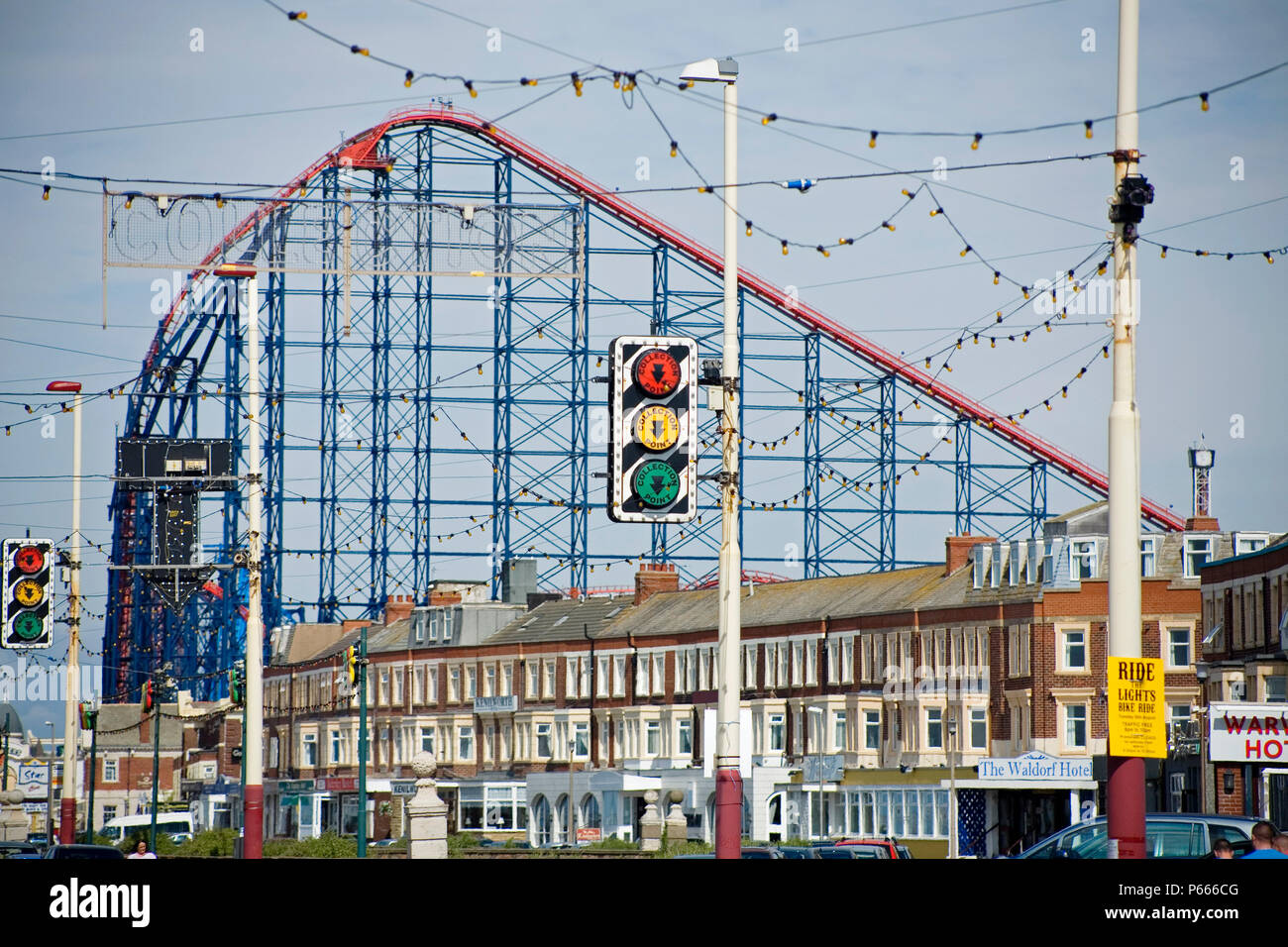 View of rollercoaster on Blackpool's Pleasure Beach, above terraced houses Stock Photo