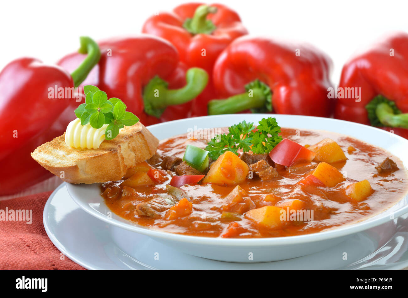 Typical Hungarian goulash soup with baguette Stock Photo