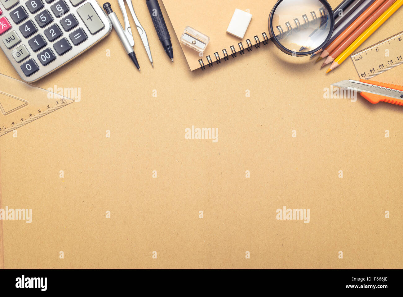 Overhead shot of school supplies on craft paper background Stock Photo