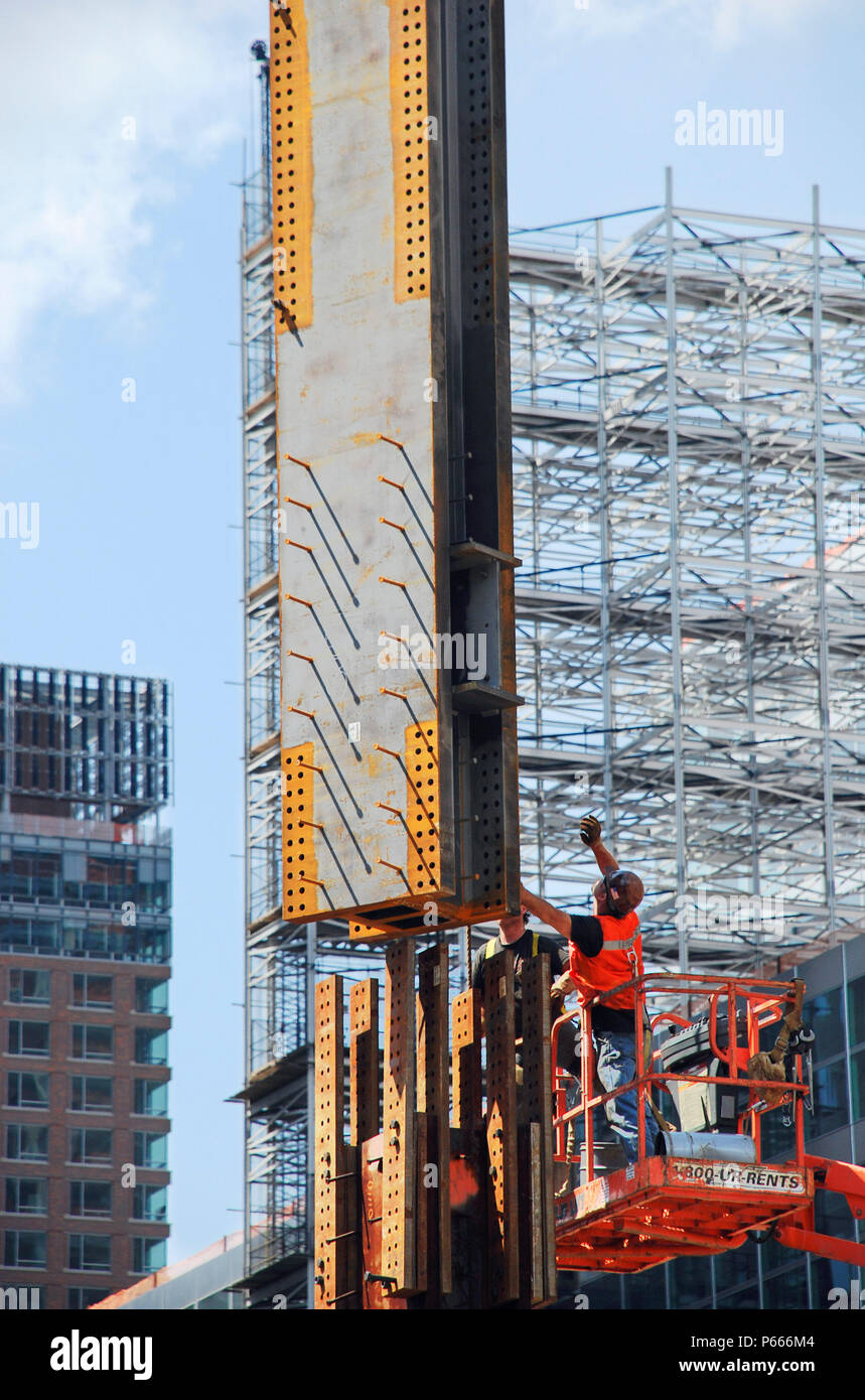 Steel column being moved into position over another steel column at Tower One site, Lower Manhattan, New York City, USA Stock Photo