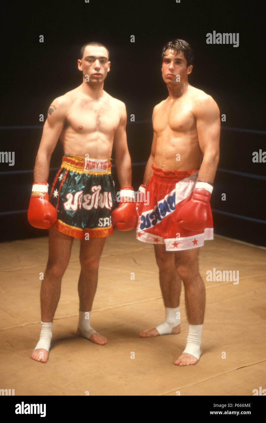 LOS ANGELES, CA - DECEMBER 7: (EXCLUSIVE) (L-R) Fighter Ronny Flas and Actor John Haymes Newton, aka John Newton on set of 'Desert Kickboxer' on December 7, 1991 in Los Angeles, California. Photo by Barry King/Alamy Stock Photo Stock Photo