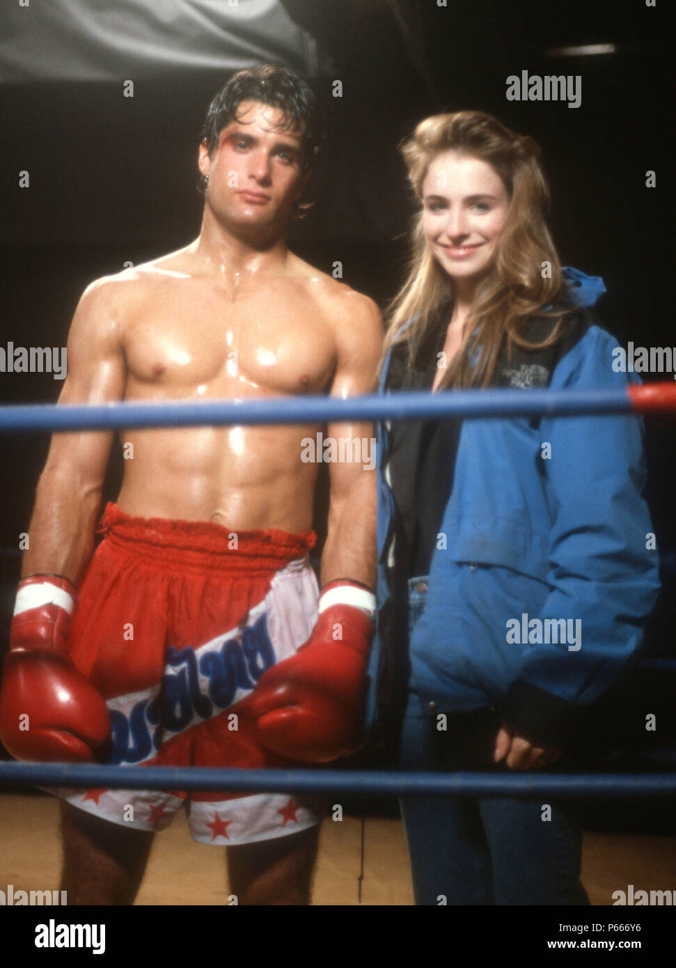 LOS ANGELES, CA - DECEMBER 7: (EXCLUSIVE) Actor John Haymes Newton, aka John Newton (L) and girlfriend on set of 'Desert Kickboxer' on December 7, 1991 in Los Angeles, California. Photo by Barry King/Alamy Stock Photo Stock Photo