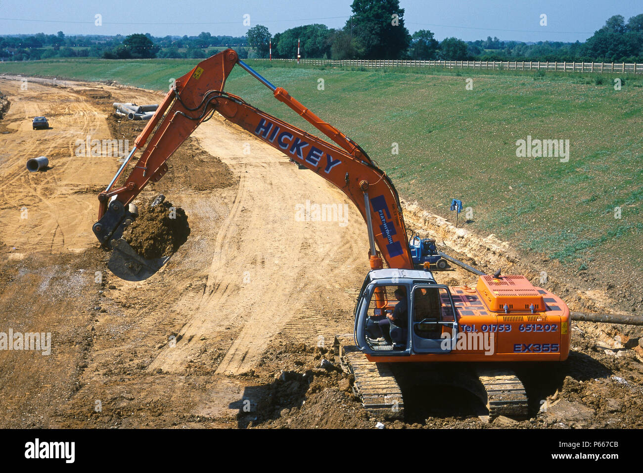 Fiat-Hitachi EX355 crawler excavator during preparation of formation for construction of Great Leighs bypass. Essex, United Kingdom. Stock Photo