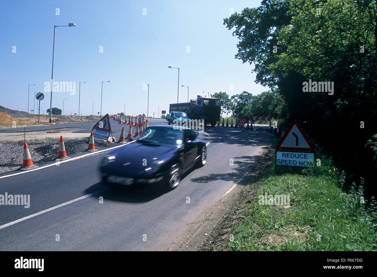 Traffic negotiating traffic management during construction of Great Leighs bypass. Essex, United Kingdom. Stock Photo