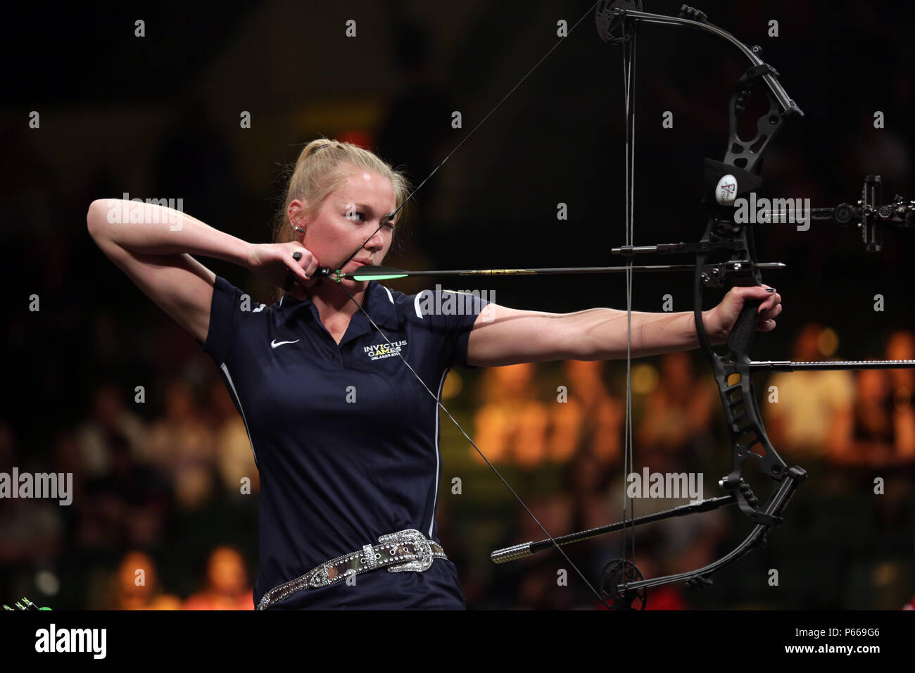 U. S. Army Spec. Chasity Kuczer, takes aim of the target during the Open Compound Gold Medal match of the archery competition, winning a silver medal for the United States team at the 2016 Invictus Games.  Kuczer, a locomotive mechanic, is an Army athlete from Pulaski, WI, currently stationed at the Warrior Transition Unit, Fort Knox, KY.  She is one of 35 Soldier and Veteran Army athletes representing the US team during the Invictus Games in Orlando, FL, May 8-12.  Invictus Games, an international adaptive sports tournament for wounded, ill and injured service members and Veterans, features a Stock Photo