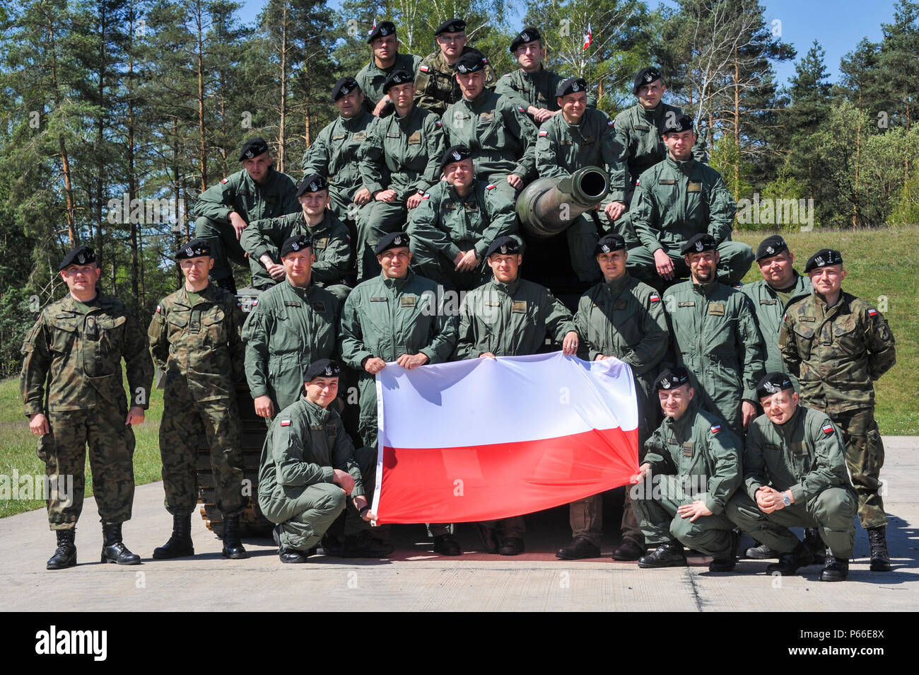 Soldiers from Poland participating in the Strong Europe Tank Challenge (SETC) pose for a group photo May 08, 2016 at Grafenwoehr Training Area, Germany. The SETC is co-hosted by U.S. Army Europe and the German Bundeswehr May 10-13, 2016. The competition is designed to foster military partnership while promoting NATO interoperability. Seven platoons from six NATO nations are competing in SETC - the first multinational tank challenge at Grafenwoehr in 25 years. For more photos, videos and stories from the Strong Europe Tank Challenge, go to http://www.eur.army.mil/tankchallenge/ (U.S. Army photo Stock Photo