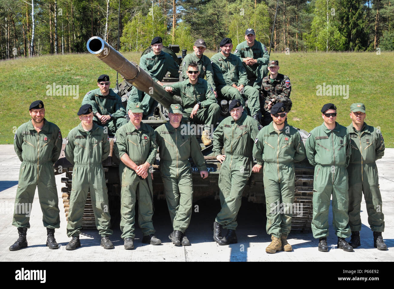 Soldiers from Slovenia participating in the Strong Europe Tank Challenge (SETC) pose for a group photo May 08, 2016 at Grafenwoehr Training Area, Germany. The SETC is co-hosted by U.S. Army Europe and the German Bundeswehr May 10-13, 2016. The competition is designed to foster military partnership while promoting NATO interoperability. Seven platoons from six NATO nations are competing in SETC - the first multinational tank challenge at Grafenwoehr in 25 years. For more photos, videos and stories from the Strong Europe Tank Challenge, go to http://www.eur.army.mil/tankchallenge/ (U.S. Army pho Stock Photo
