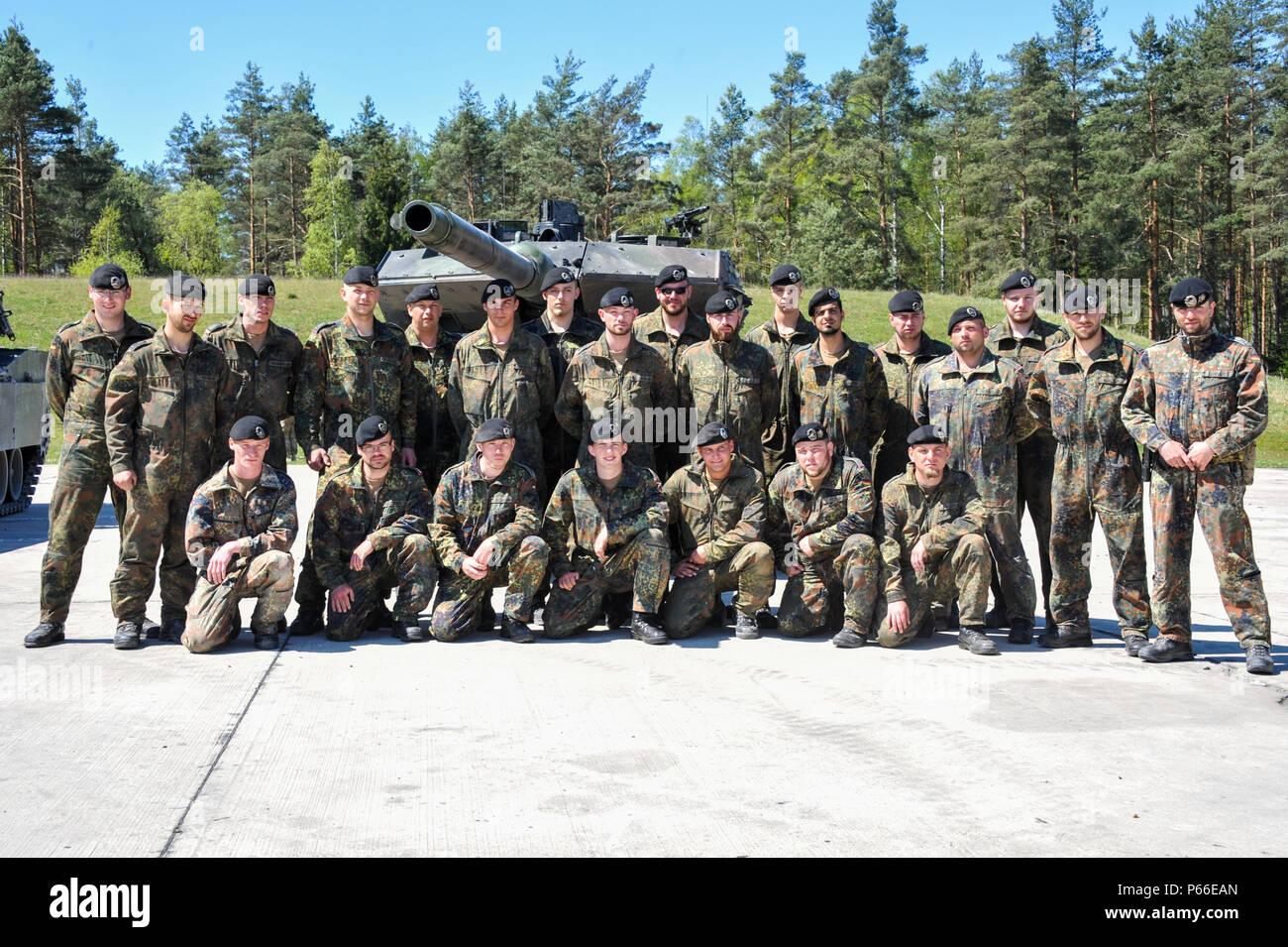 Soldiers from Germany participating in the Strong Europe Tank Challenge (SETC) pose for a group photo May 08, 2016 at Grafenwoehr Training Area, Germany. The SETC is co-hosted by U.S. Army Europe and the German Bundeswehr May 10-13, 2016. The competition is designed to foster military partnership while promoting NATO interoperability. Seven platoons from six NATO nations are competing in SETC - the first multinational tank challenge at Grafenwoehr in 25 years. For more photos, videos and stories from the Strong Europe Tank Challenge, go to http://www.eur.army.mil/tankchallenge/ (U.S. Army phot Stock Photo