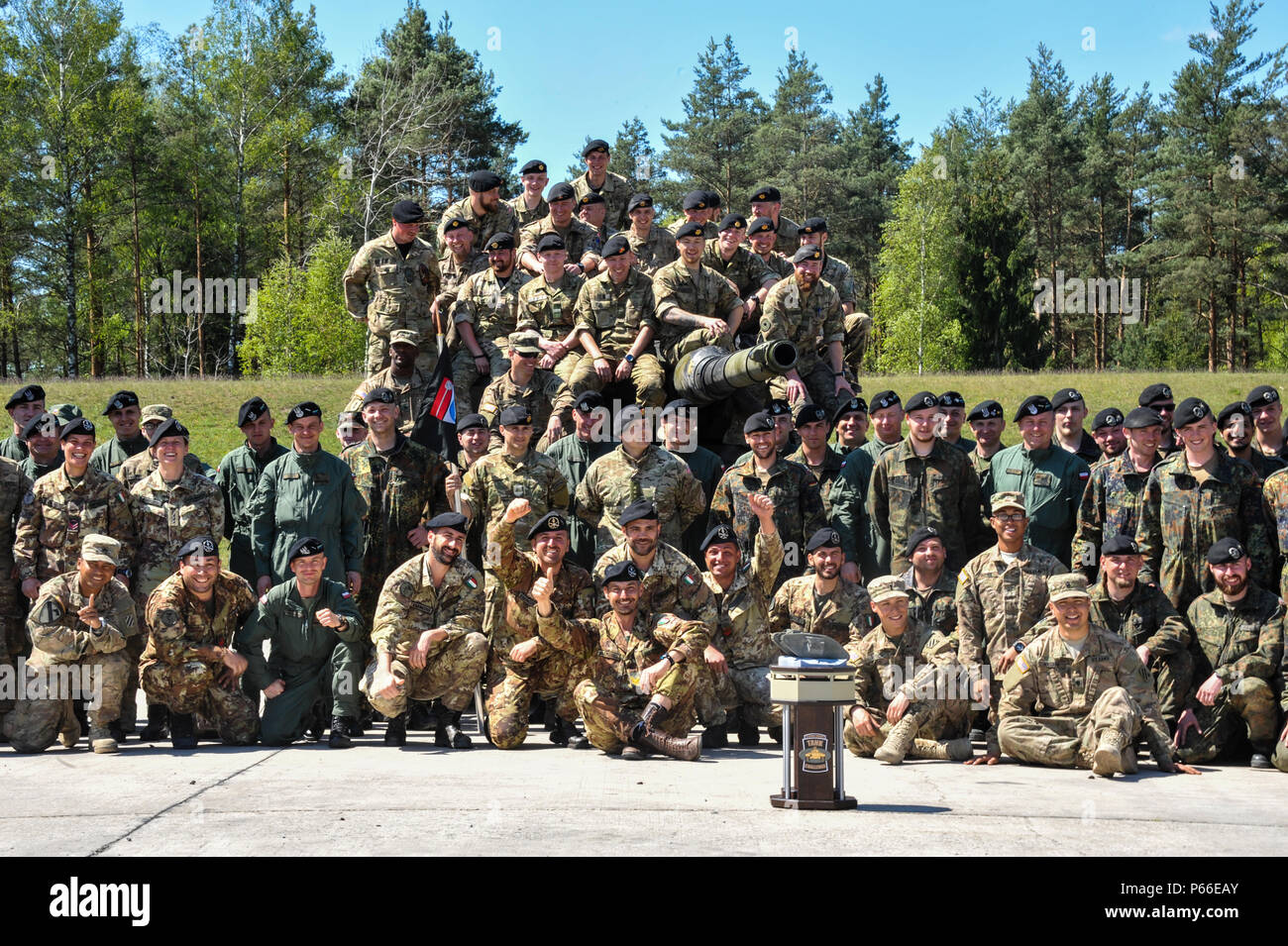 Soldiers from all nations participating in the Strong Europe Tank Challenge (SETC) pose for a group photo May 08, 2016 at Grafenwoehr Training Area, Germany. The SETC is co-hosted by U.S. Army Europe and the German Bundeswehr May 10-13, 2016. The competition is designed to foster military partnership while promoting NATO interoperability. Seven platoons from six NATO nations are competing in SETC - the first multinational tank challenge at Grafenwoehr in 25 years. For more photos, videos and stories from the Strong Europe Tank Challenge, go to http://www.eur.army.mil/tankchallenge/ (U.S. Army  Stock Photo