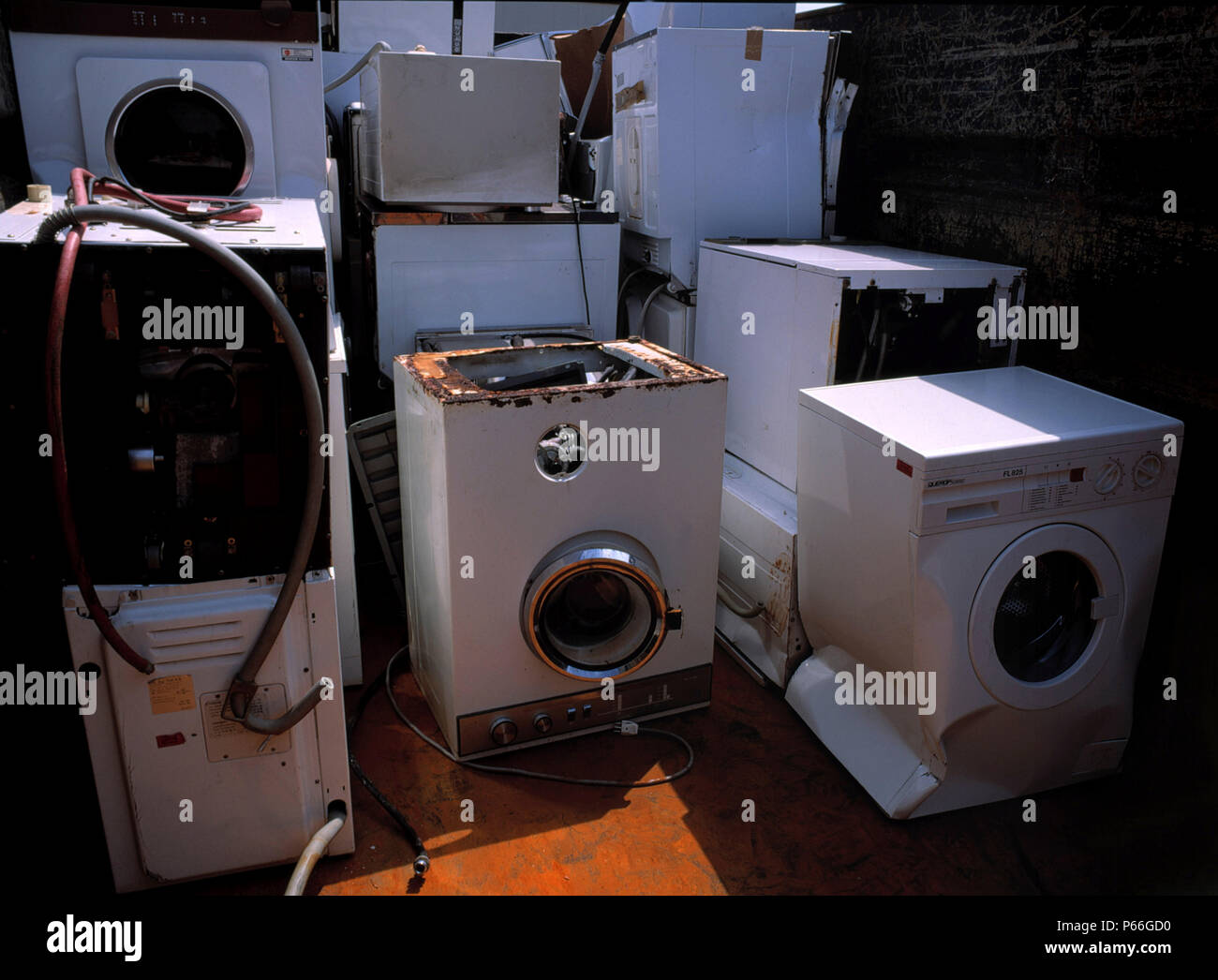 Broken washing machines collected for recycling Stock Photo Alamy