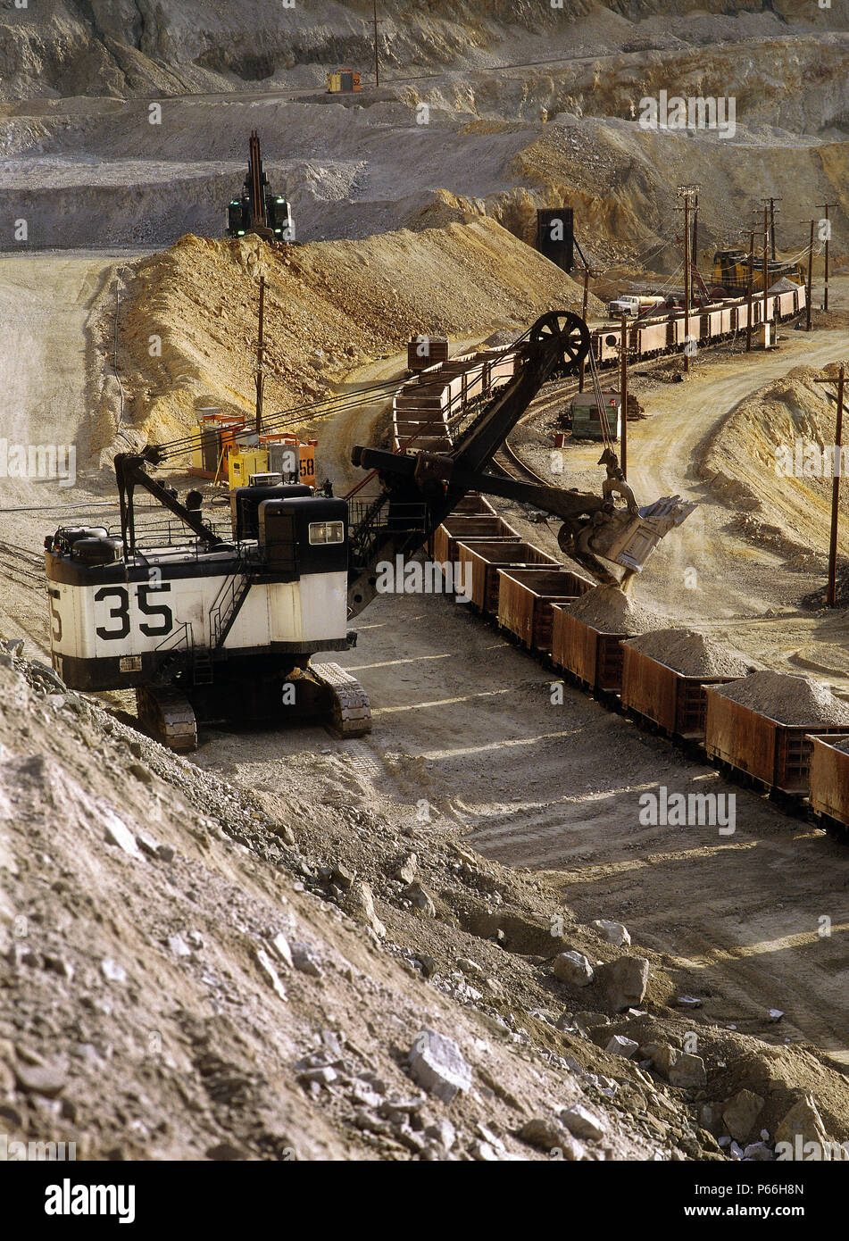 Loading rail wagons. Kennecott Bingham Canyon copper and gold mine, the biggest hole in the world. Salt Lake City, Utah, USA. Stock Photo