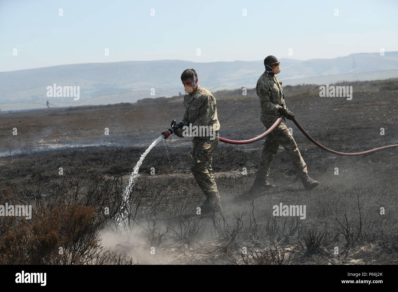Soldiers from the Royal Regiment of Scotland on Saddleworth Moor near Manchester where they are helping to fight a vast moorland blaze which has been alight for several days. Stock Photo