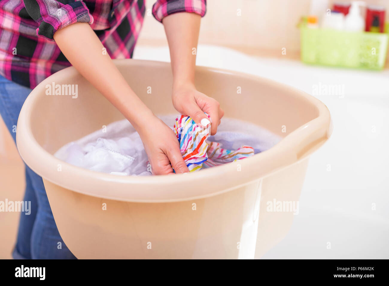 Woman hand wash clothes hi-res stock photography and images - Alamy