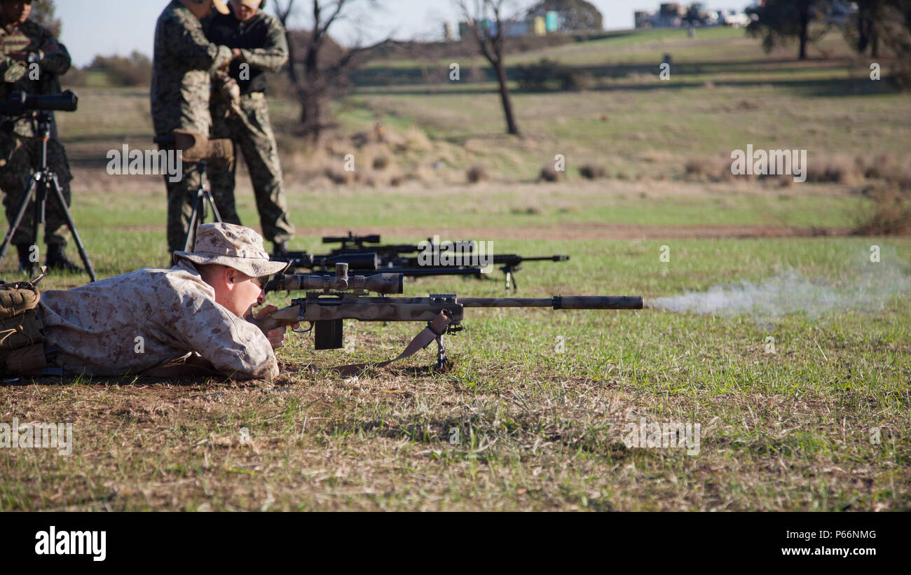 Cpl. John Luze, a competitor with the Marine Corps Shooting Team, fires a  round with his M40A5 sniper rifle during a practice fire at Puckpunyal  Military Area in Victoria, Australia, May 7,